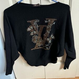 Sweater fits size small to medium